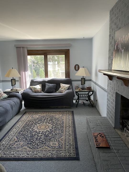 Living room in a calm blue-gray with crisp white trim
